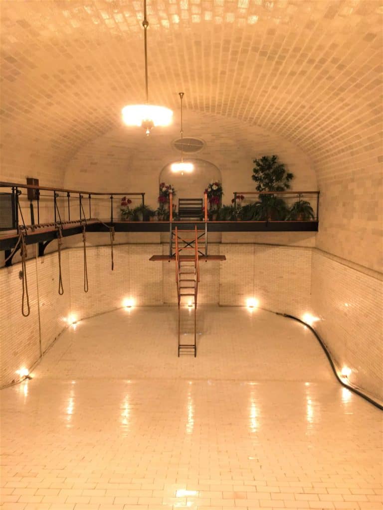 A shiny white tiled room that was once the indoor pool at the Biltmore Estate.