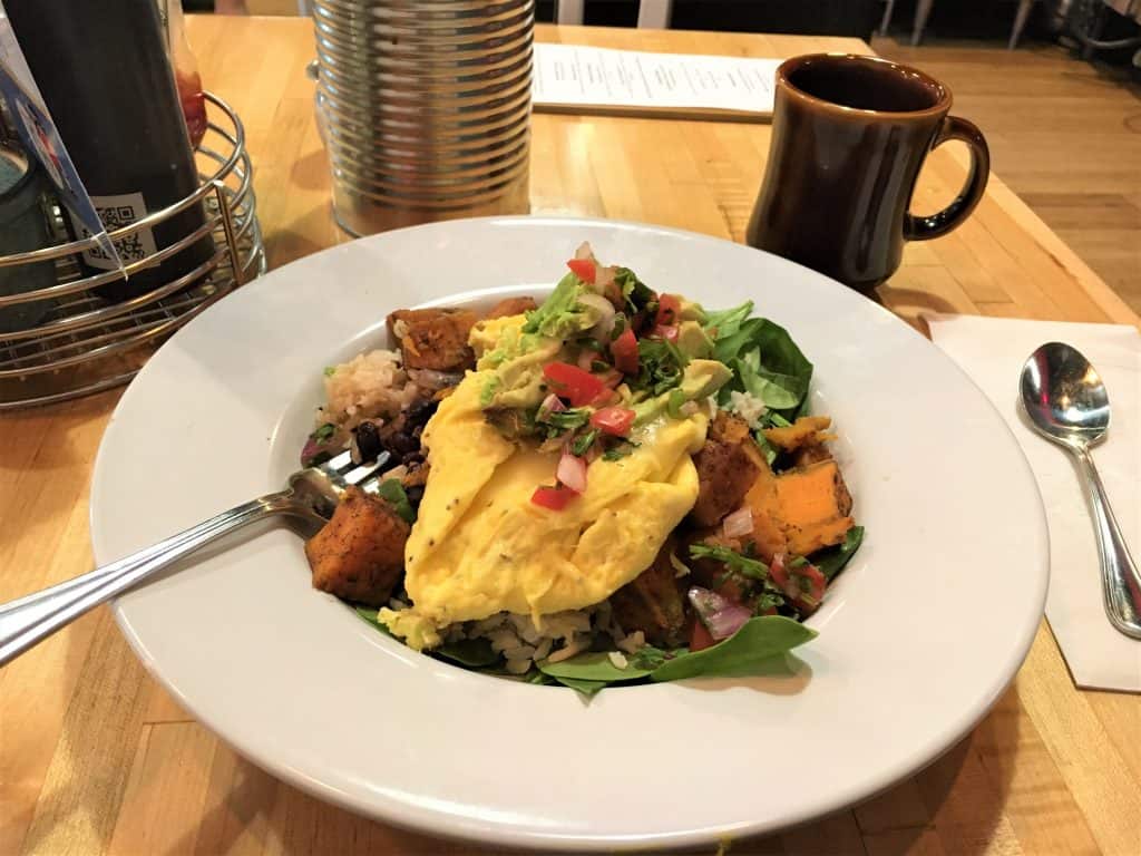 Veggie bowl topped with egg.
