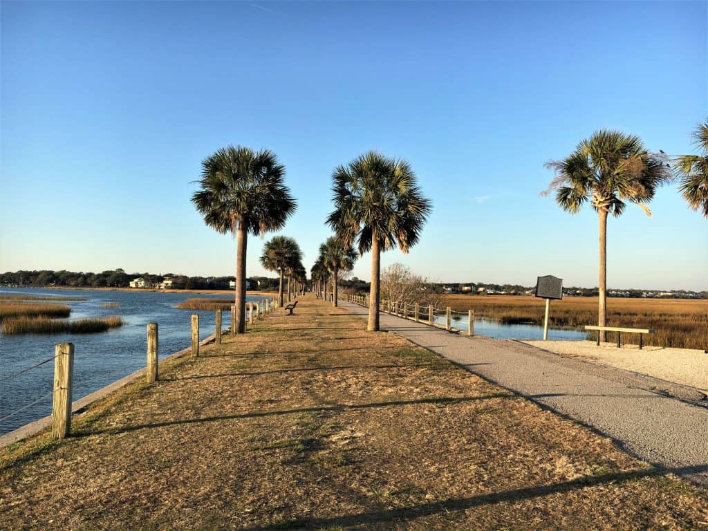 The Pitt Street Bridge starts as a walkway along grass and ends at what remains of the old bridge.