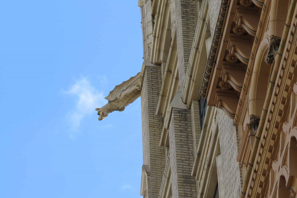 Gargoyle on the top of the Jackson Building, a gothic tower.