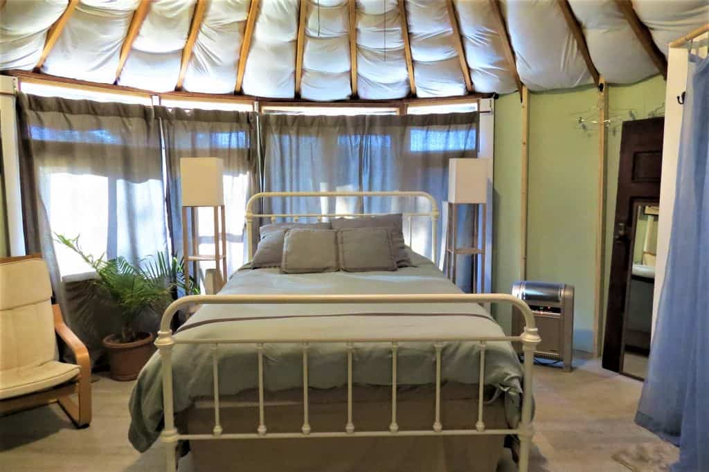 Interior of Yurt with the queen bed taking up most of the room.