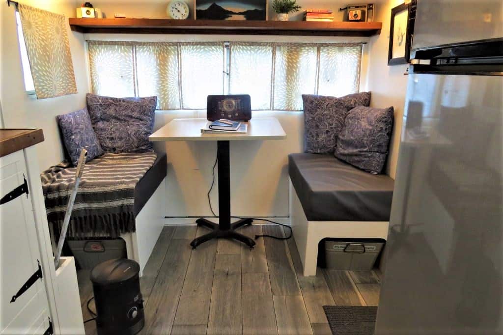 Other side of trailer has small eating and working area.