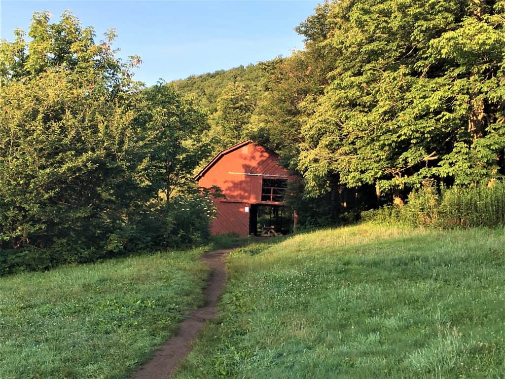 The iconic Overmountain Shelter. A two story red barn on the Appalachian Trail.