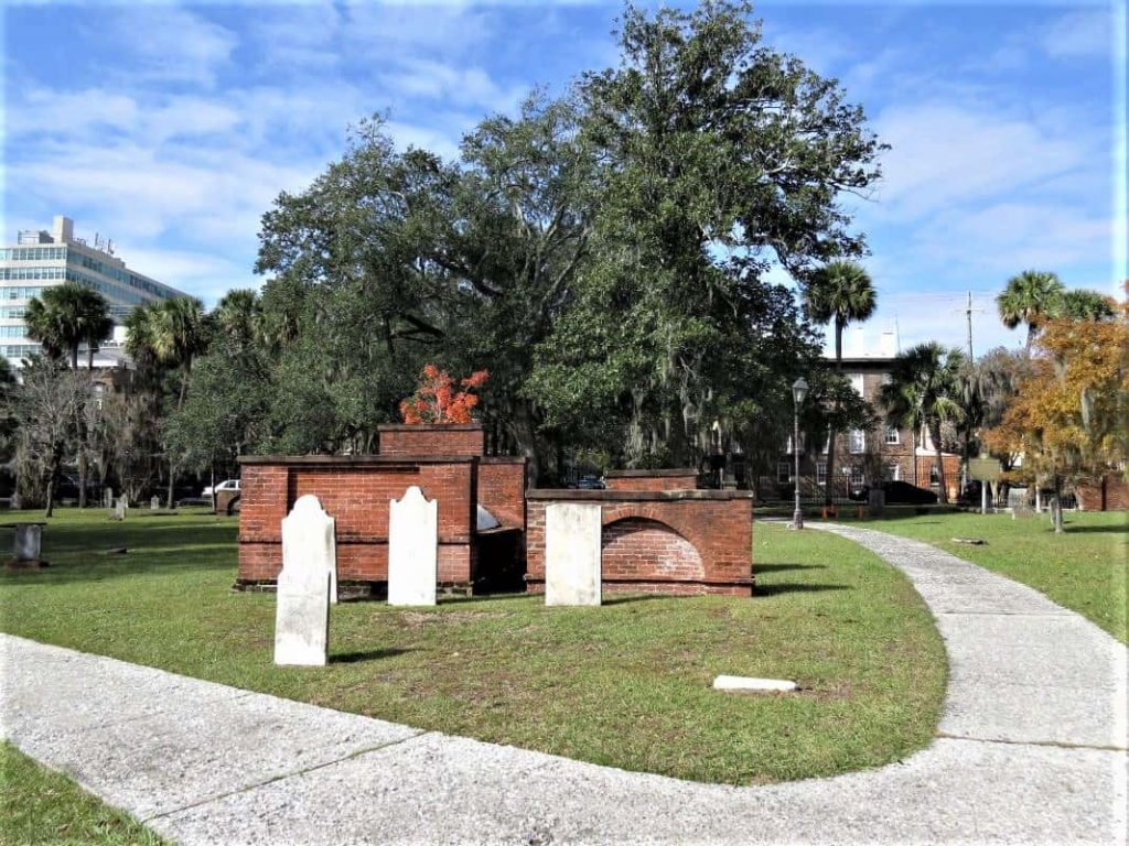 Red brick structures near tombs at Colonial Park Cemetery were used to store special items.