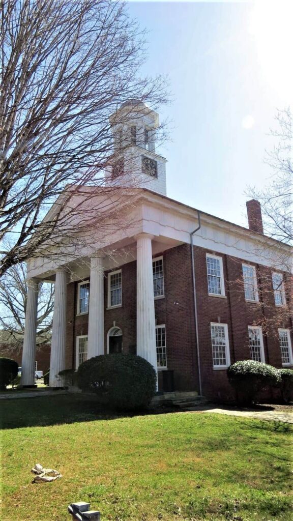 Orange County Courthouse red brick building with large white pillars at the front was built in the 1800s.