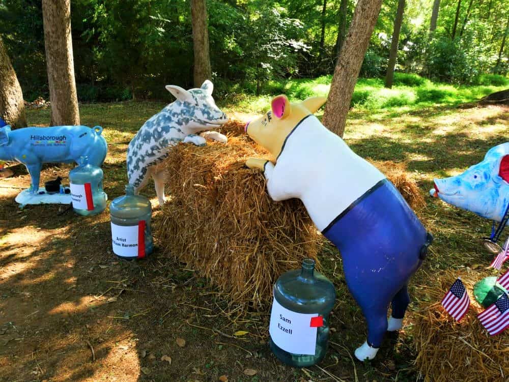 Two pig statues posed at the Pig Parade area
