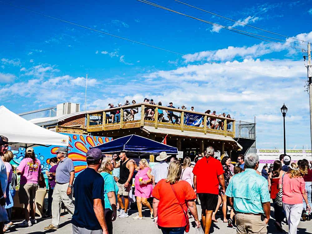 NC Seafood Festival attendees on a local rooftop bar with a birds-eye view.