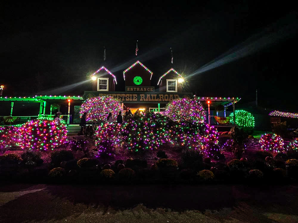 Outside view of the ticket building entrance with colored lights for Ghost Train Halloween celebration.