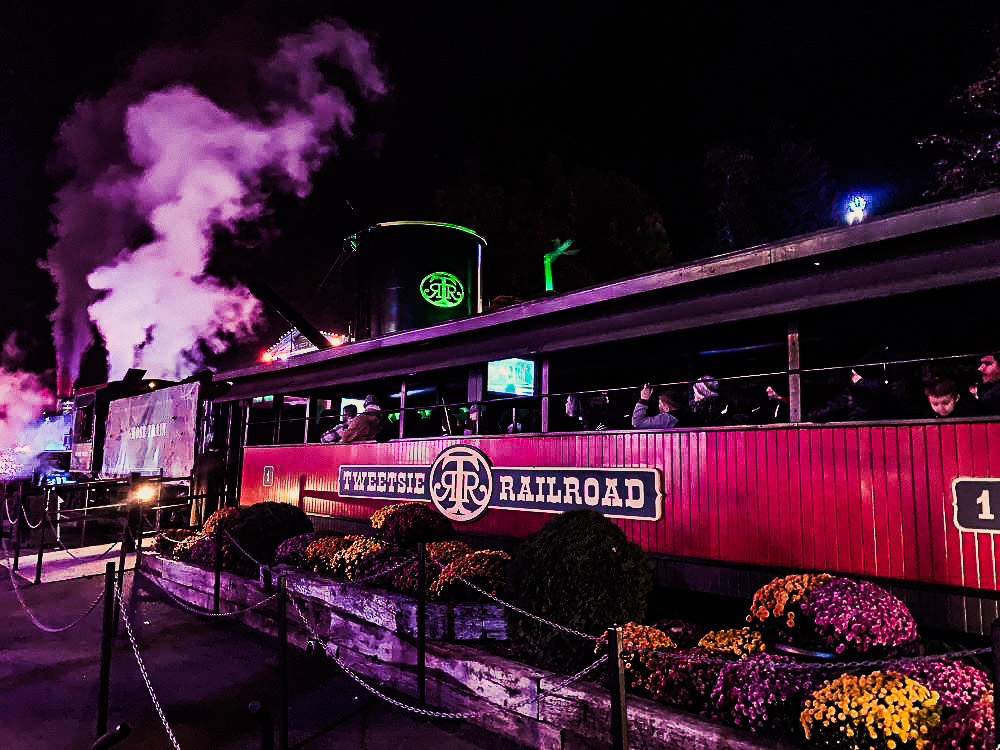 Side view of the Ghost Train first passenger car as it pulls out of Main Street.