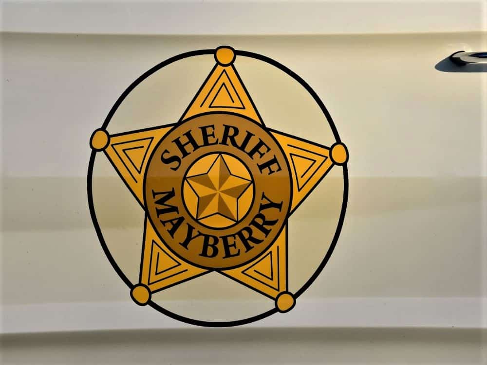 Mayberry Sheriff badge decal on the side of a car.