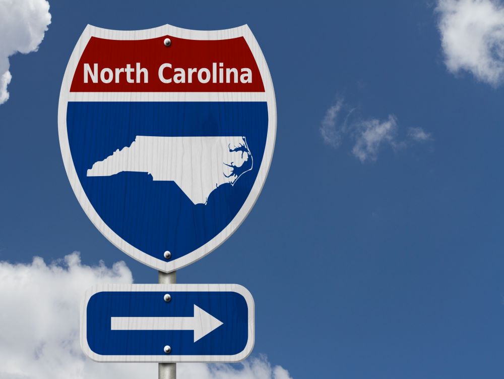North Carolina road sign with arrow pointing right.