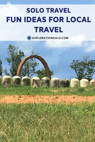 Pinterest pin with a photo of a large copper ring with small concrete pillars in front. The text says "Solo travel. Fun ideas for local travel". 