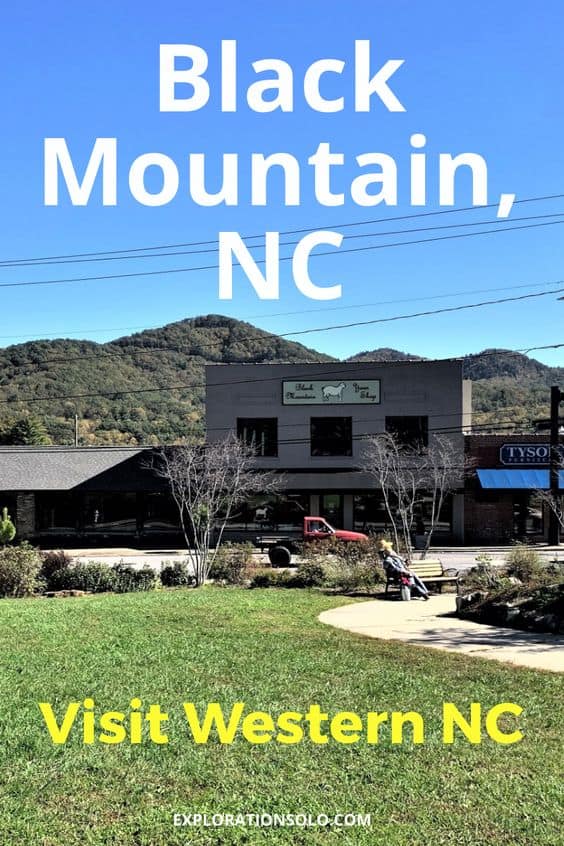 Pinterest pin with a photo of a two story grey building and mountains in the background. The text says, "Black Mountain, NC. Visit Western NC."