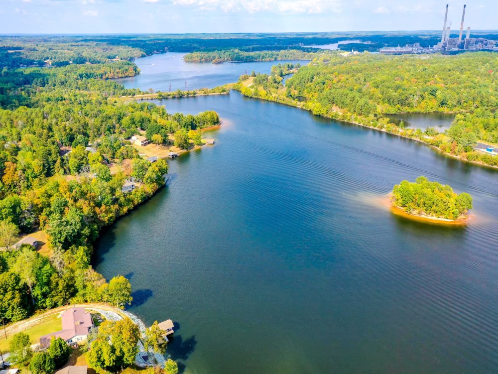Aerial view of Belews lake with a bridge in the middle.
